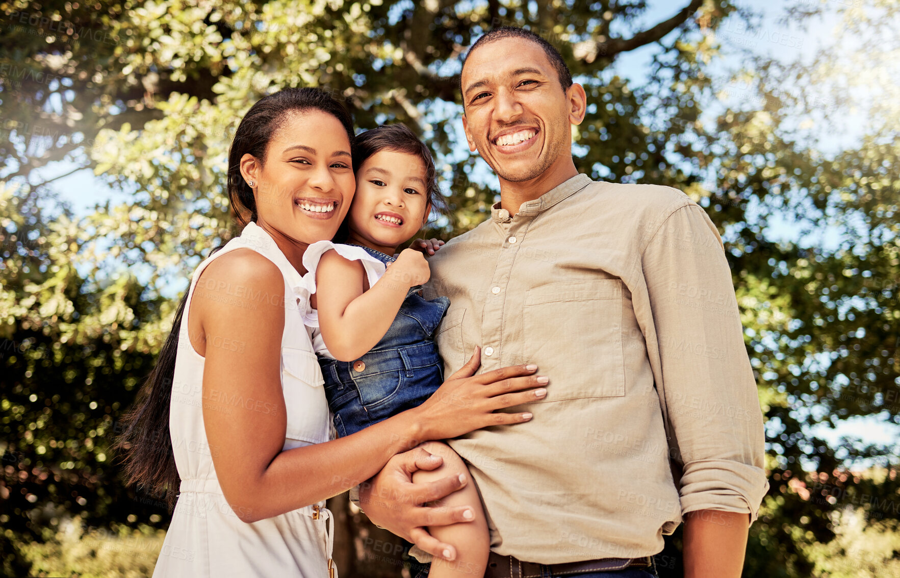 Buy stock photo Black family, smile and child for portrait, together and park while outdoor, trees and happiness in sunshine. Mom, dad and child in nature, happy and bonding as family in summer, love and bond