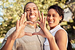 Hands, heart and love with a black couple sign outdoor in the garden of their home together. Happy, hand and romance with a man and woman making a shape with their fingers while bonding outside