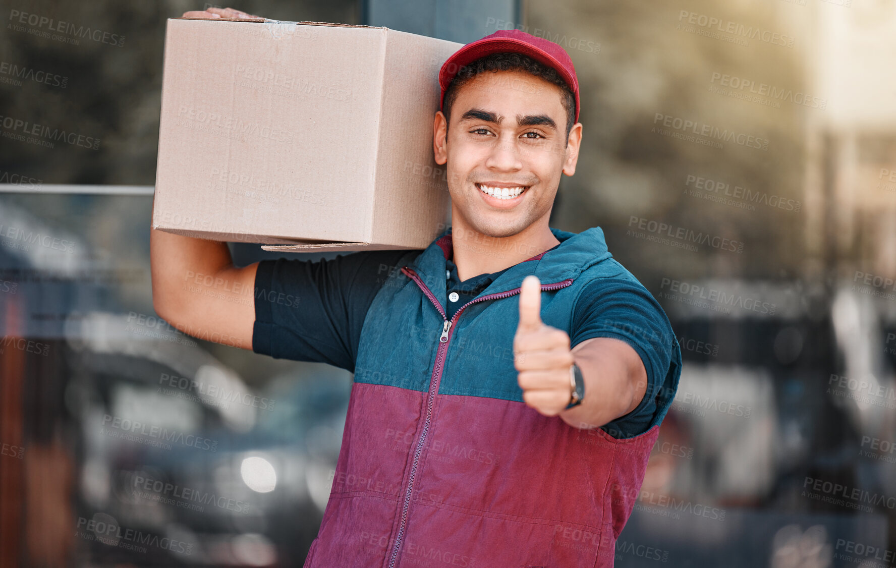 Buy stock photo Portrait, box and delivery worker with thumbs up gesture and a big smile carrying cargo, stock or a package. Happy delivery man with a thumb up holding a cardboard packaging or mail post outdoors