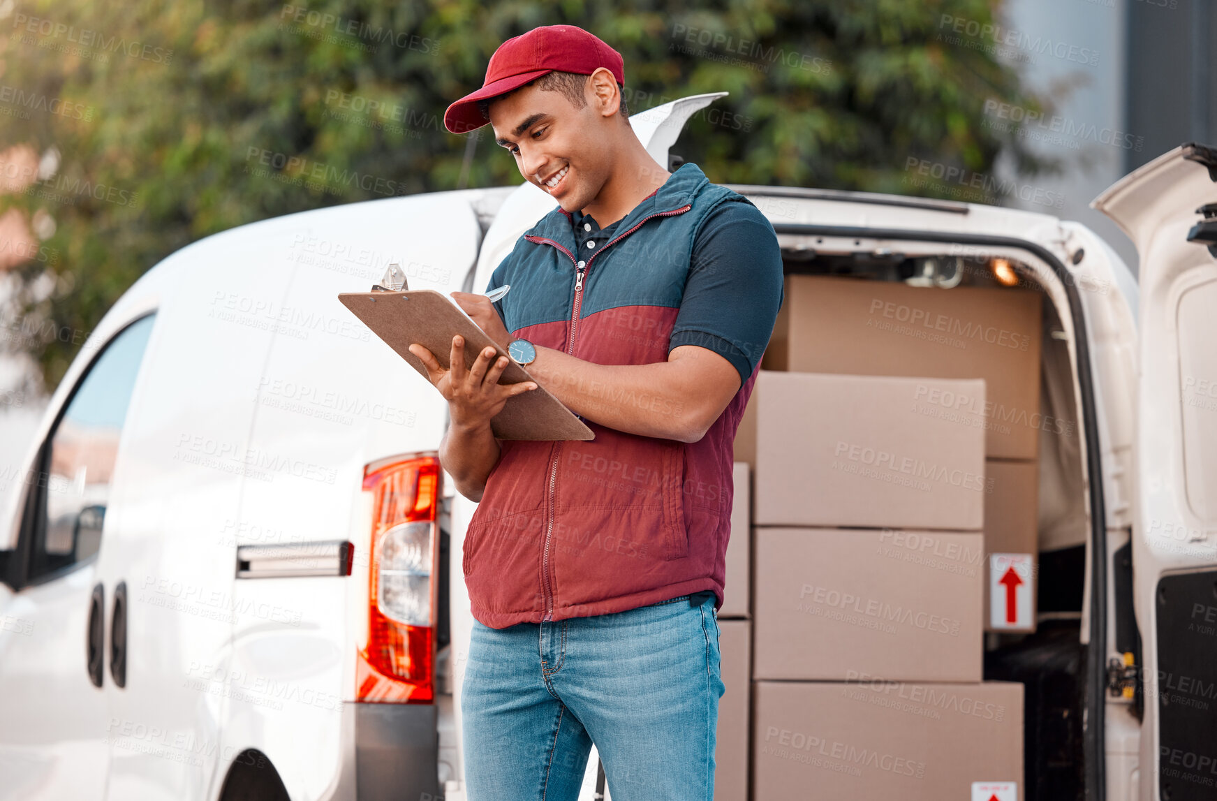 Buy stock photo Delivery, inventory and courier writing on paperwork while working in the ecommerce business. Happy, young and logistics worker with smile for documents, paper and transportation of boxes in a van