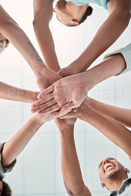Buy stock photo Hands, collaboration and unity with a business team in a huddle or circle in the office together from below. Meeting, success and motivation with a man and woman group standing in solidarity
