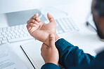 Hands of business man with pain, carpal tunnel syndrome or strain from corporate job, working or typing on keyboard. Arthritis risk, hurt and wrist of black man or office employee with injury problem