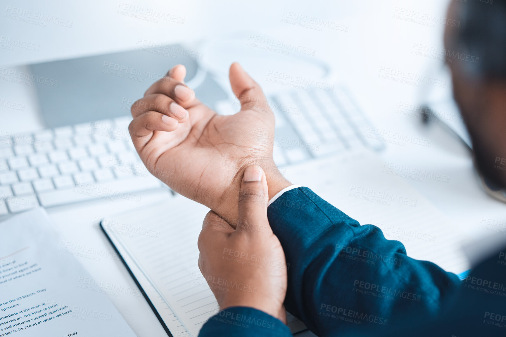 Buy stock photo Hands of business man with pain, carpal tunnel syndrome or strain from corporate job, working or typing on keyboard. Arthritis risk, hurt and wrist of black man or office employee with injury problem