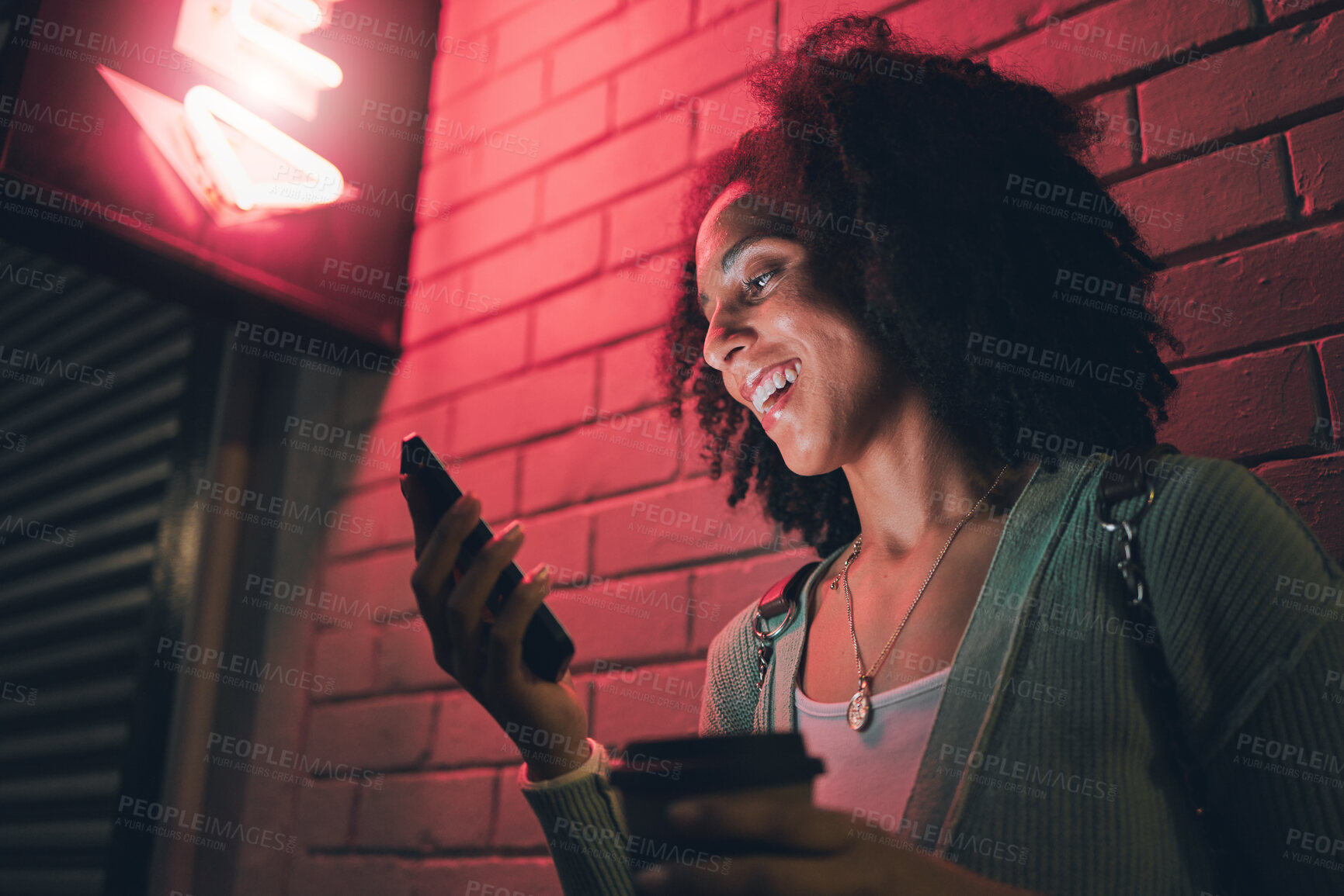 Buy stock photo Black woman, phone and night in city with smile on social media, app or communication on travel, tourist or adventure. Woman, smartphone and metro on web, internet or chat for happiness on smartphone