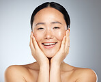 Cosmetics, asian woman and facial care for natural beauty, wellness and smile being happy, studio background and healthy. Portrait, makeup and organic facial for skincare, health and relax body care.