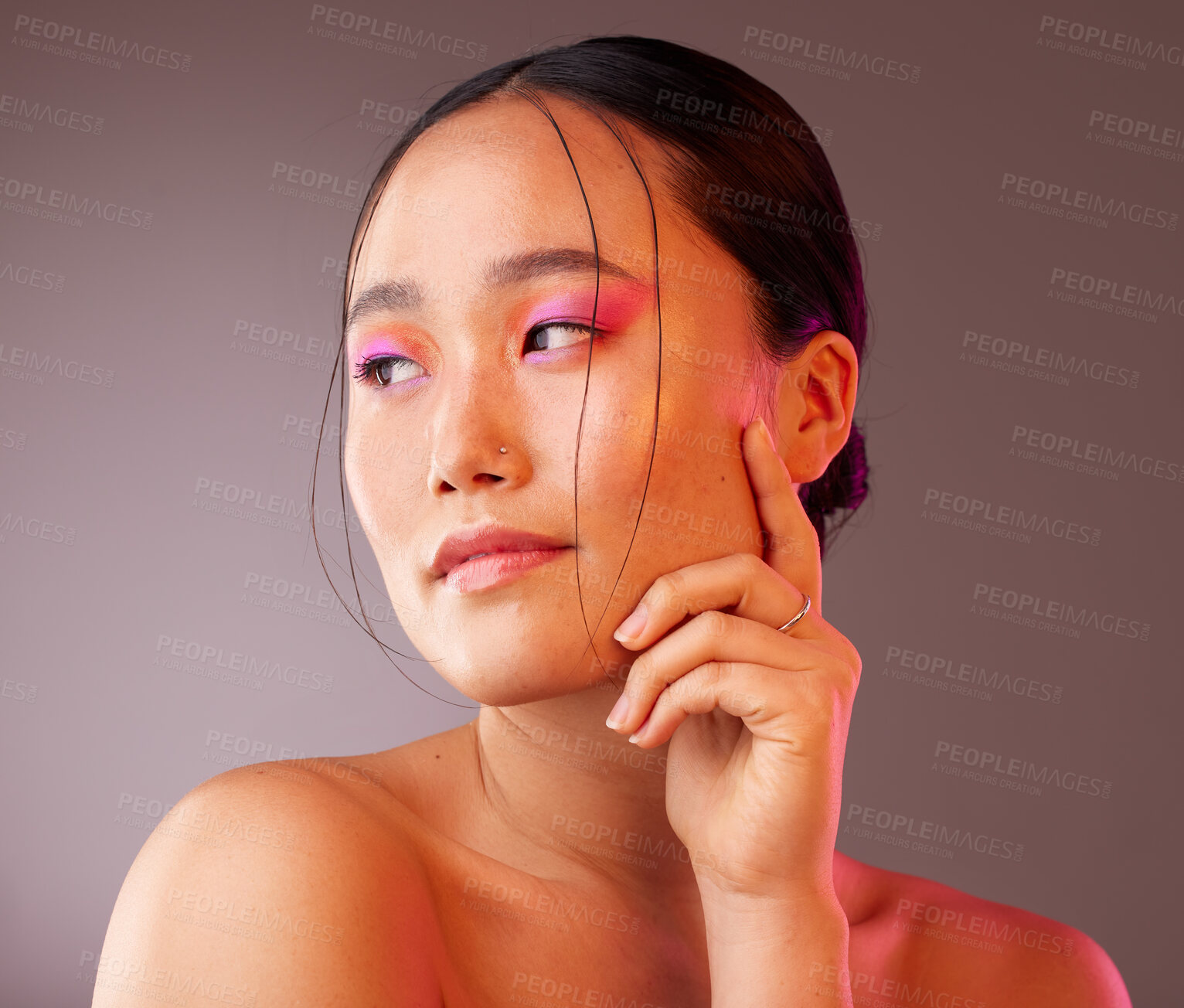 Buy stock photo Beauty, makeup and asian woman with colourful eyeshadow isolated against a studio background. Cosmetics, glowing skin and chinese woman with glamour eye makeup. Smooth and perfect skin after a facial