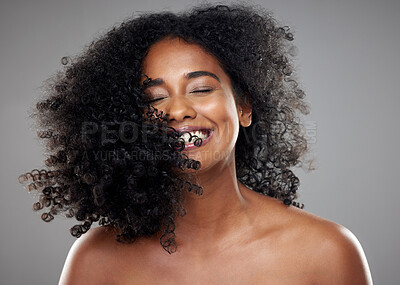 Buy stock photo Black woman, hair and beauty, hair care or curly hair on gray studio background. Smile, skincare and young beautiful female model from Nigeria with healthy curls after luxury salon treatment.






