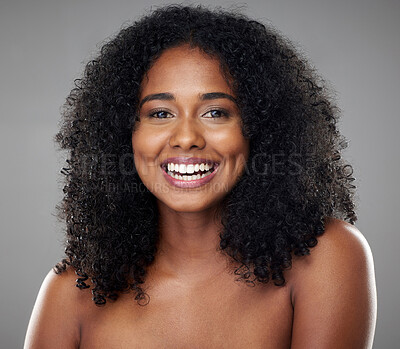 Buy stock photo Black woman, beauty and smile, hair and skin, natural cosmetics advertising with skincare and hair care treatment portrait. Makeup, facial wellness and body care with grey studio background. 