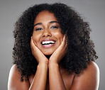 Face, beauty and skincare of happy black woman on gray studio background. Health, wellness and smile of female model from South Africa in makeup, facial cosmetics or beautiful, curly and healthy hair