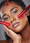 Face, beauty and serum with a model black woman in studio on a gray background for health or wellness. Portrait, skincare and antiaging with a female closeup to promote a product for healthy skin