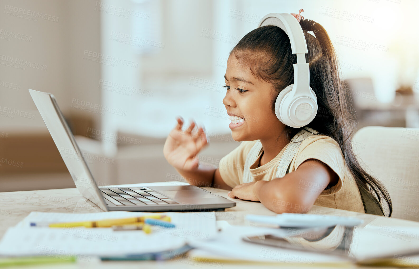 Buy stock photo Video call, online education and child with laptop, headphones and home table for e learning virtual class. Hello, zoom call and girl kid in elearning school listening to audio kindergarten language