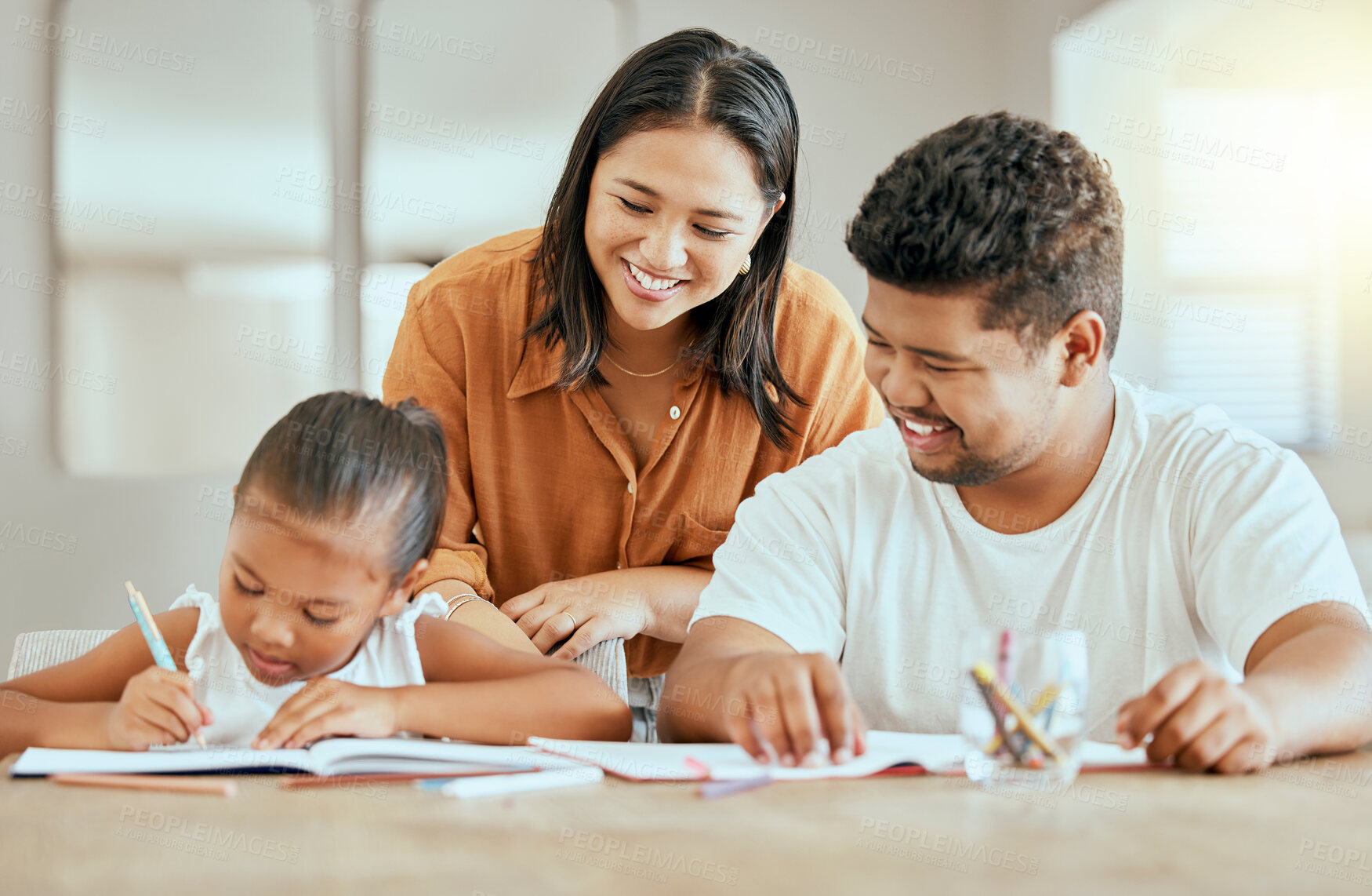 Buy stock photo Home, education and parents with chid writing, helping and book learning language development. Happy people, mother and father teaching girl kid for love, support and care for creative kindergarten