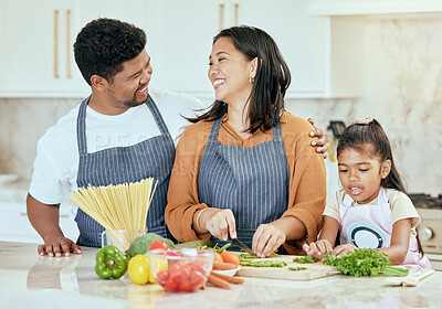 Buy stock photo Cooking, kitchen and family with a girl, mother and father preparing food for a meal in their home together. Children, health and diet with a man, woman and daughter making dinner in a house