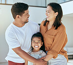 Happy, love and family with a smile at their house standing, embracing and bonding together outdoors. Happiness, mother and father holding their with a girl child with care outside of their new home.