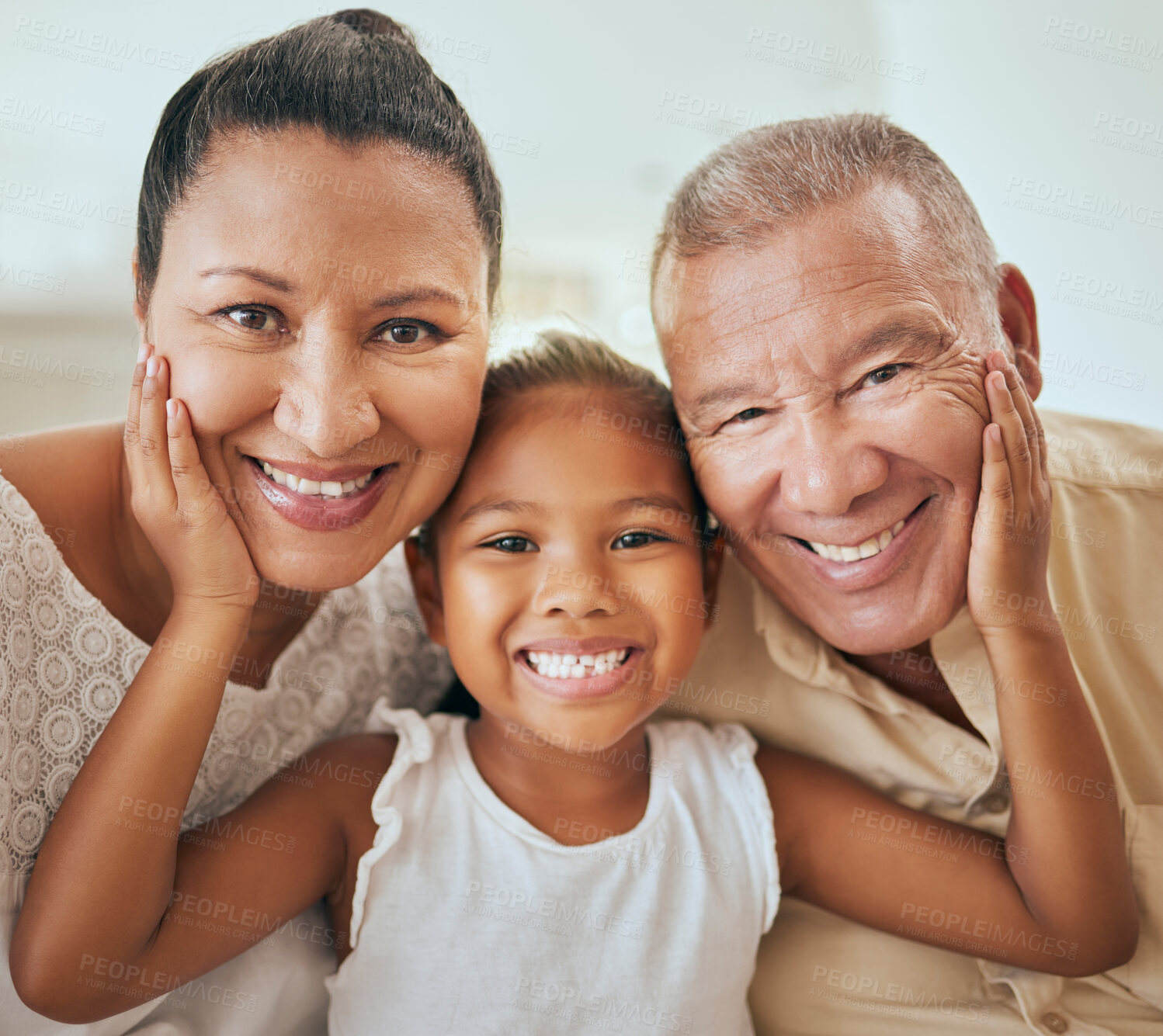 Buy stock photo Family, portrait and face of girl with grandparents relax, bond and having fun in a living room, happy and content. Happy family, smile and child hugging senior man and woman, enjoy quality time 