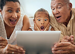 Tablet, family and shocked face child look at video online bonding together at home. Wow grandparents, young girl and fun activity streaming movie or excited news on digital device in living room
