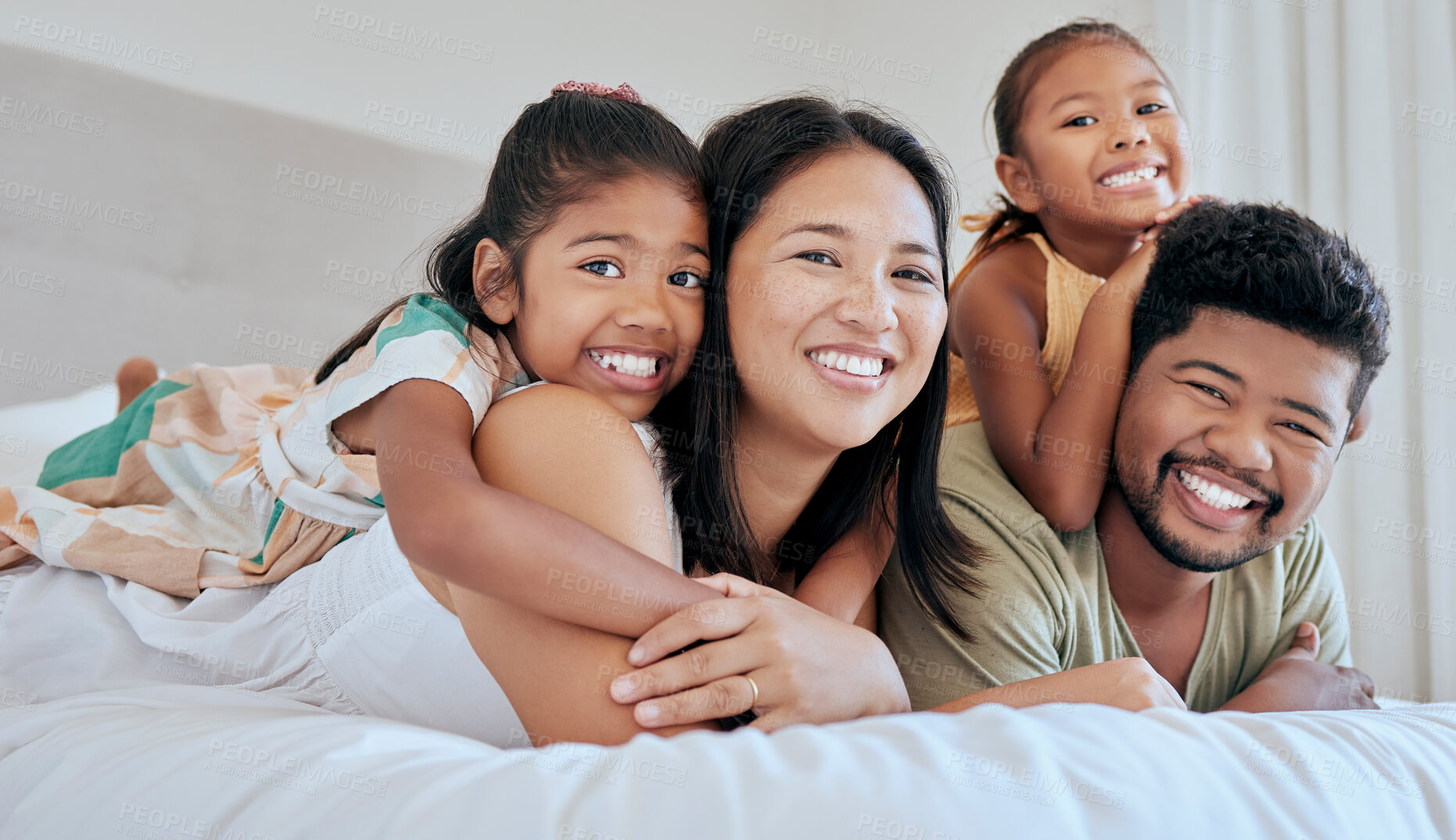 Buy stock photo Love, bed and portrait of relax happy family bonding, having fun and enjoy quality time together in Malaysia hotel bedroom. Hospitality, hug and holiday vacation for excited children, dad and mother