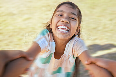 Buy stock photo Face of happy girl swinging and spinning in circles by the arms at the park with his father. Cute playful kid having fun, laugh and smile while bonding with a parent on a sunny summer outdoor
