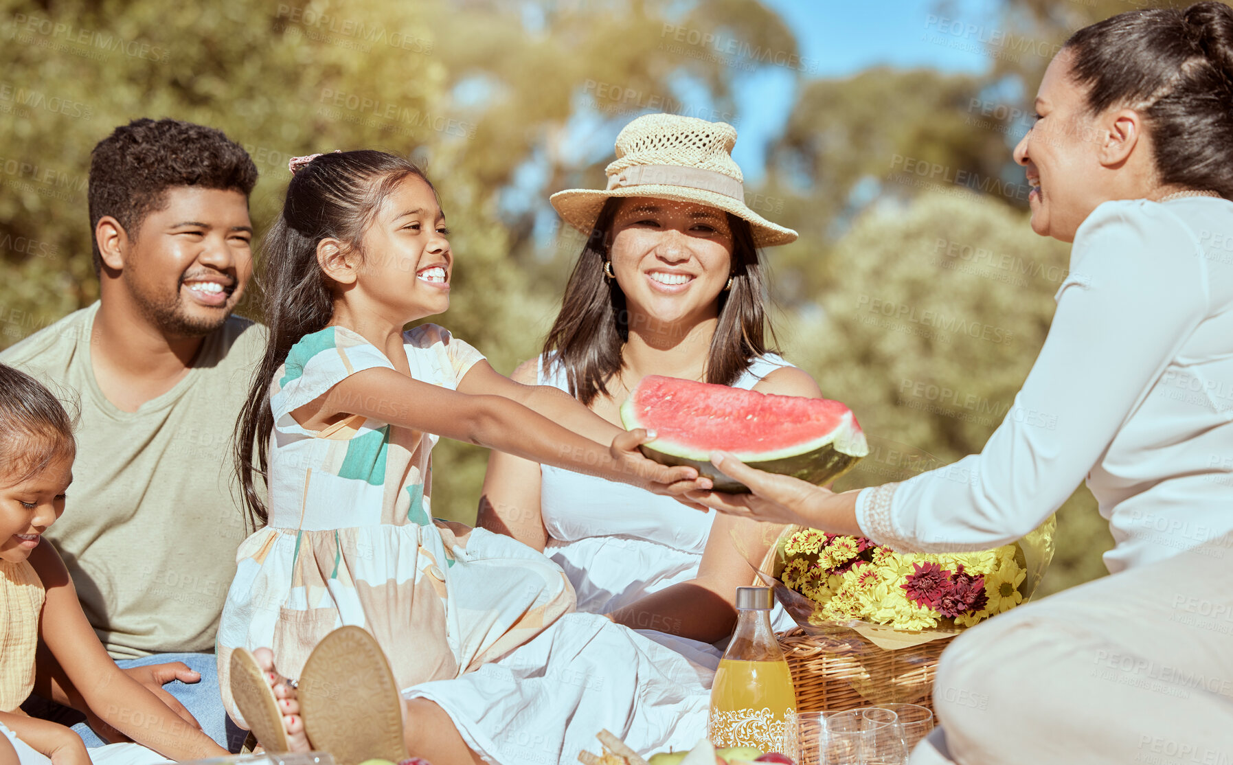 Buy stock photo Picnic, watermelon and happy family in park with summer fruits for wellness, outdoor holiday and health with children and parents. Excited Mexico people eating healthy food in green park and sunshine