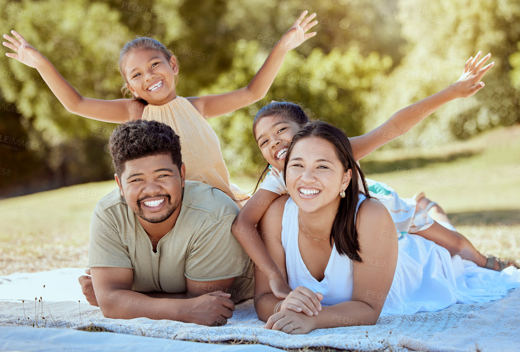 Buy stock photo Picnic park and family with children relax on blanket together for outdoor bonding, love and care with sunshine summer garden and trees. Nature, healthy and support parents with girl kids on ground