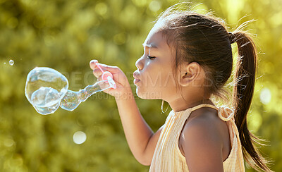 Buy stock photo Child, bubbles and nature park with asian kid outdoor on vacation in a summer garden feeling content, happy and healthy. Happiness, freedom and girl learning to blow soap bubble for hope in sun 