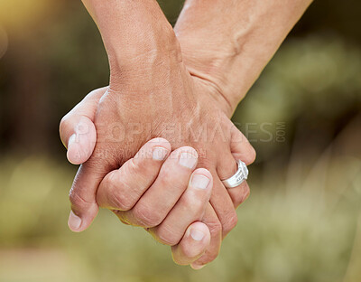 Buy stock photo Couple, hands closeup and marriage love together bonding outdoors in bokeh background. Senior man, married woman and trust loving loyalty support romance care kindness or respect in nature park