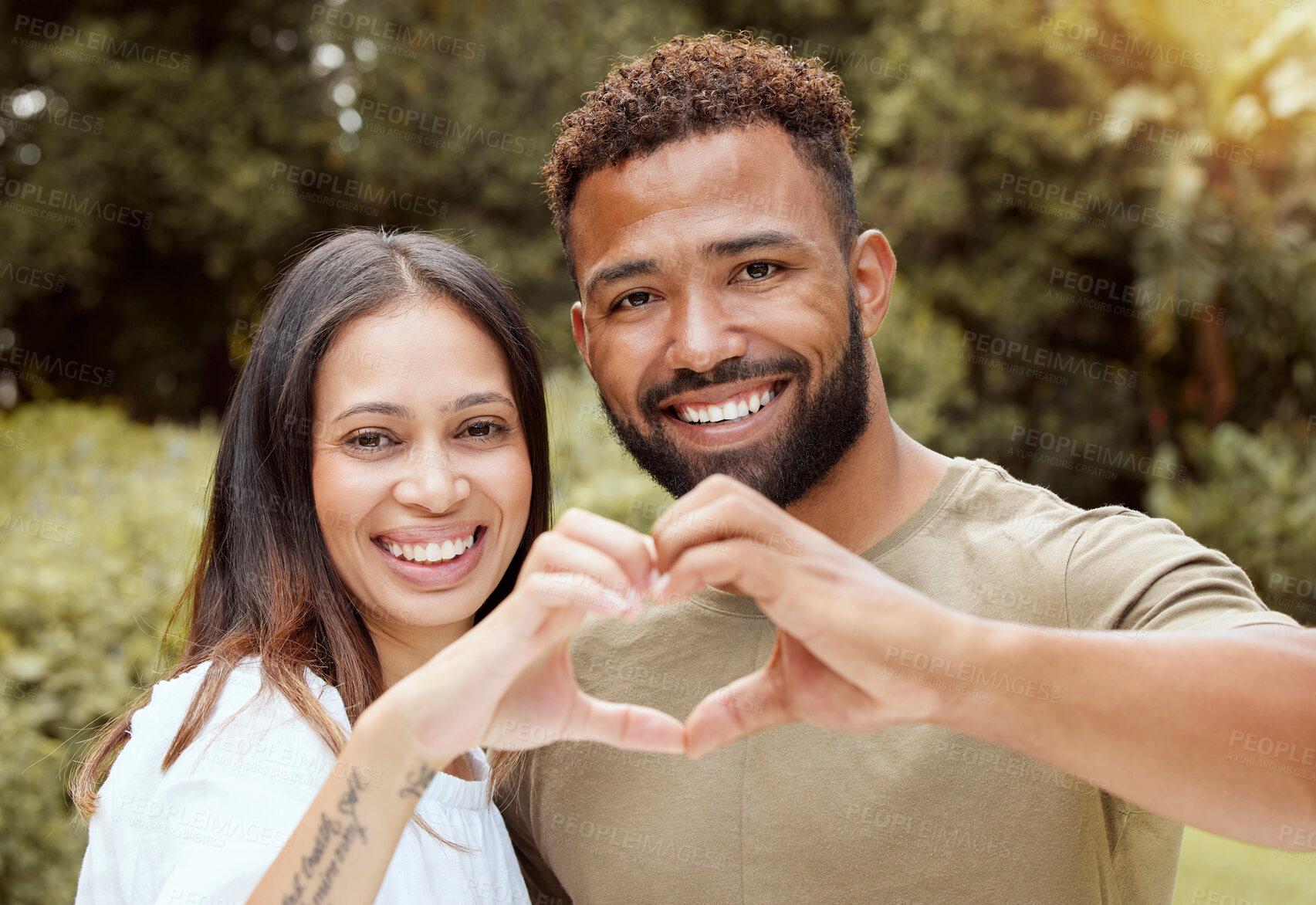 Buy stock photo Couple, happy and hand heart sign in a nature park showing love and a smile outdoor. Black people with happiness and care putting hands together to show solidarity, trust and romantic commitment