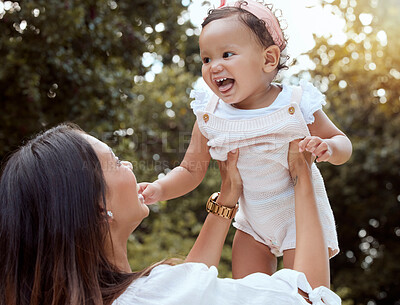 Buy stock photo Park, family and mom holding baby in air enjoying nature, outdoors and sunshine. Affection, love and mother lifting cute toddler girl smiling, bonding and playing together in garden on summer weekend