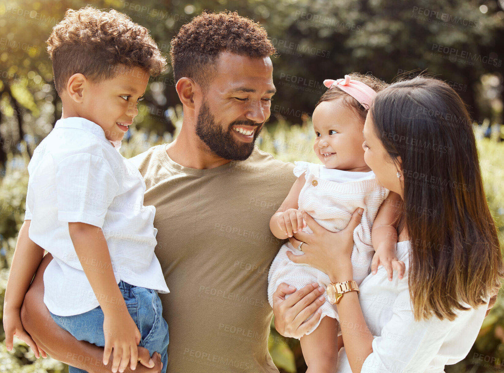 Buy stock photo Black family, happy and nature park with people holding a child and baby outdoor. Mother, father and children together in the summer sun with happiness smile and kids spending quality time outdoors