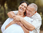 Love, senior couple and hug being happy, smile and bonding for marriage, anniversary and loving together outdoor. Romance, elderly man and mature woman doing embrace, relationship or enjoy retirement