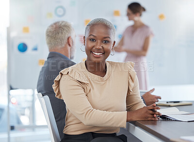Buy stock photo Portrait, black woman and business with smile, being confident and in meeting for planning, startup company and at desk in office. Female, girl and working with coworkers, strategy and documents.