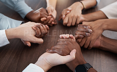 Buy stock photo People, holding hands and care in diversity for trust, unity or community support together on a table. Hands of diverse group in collaboration for teamwork, meeting or social circle in hope at work