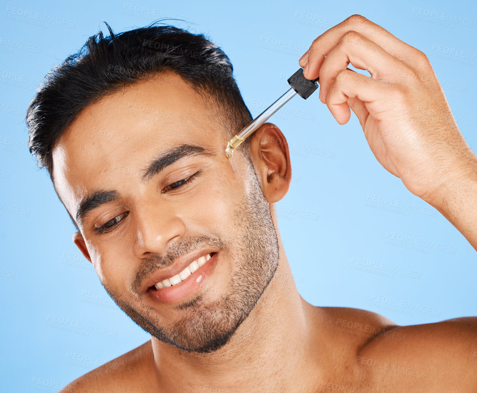 Buy stock photo Beard oil, skincare serum and young man face makeup, hair growth product and wellness on blue background. Happy arab guy model drop essential oil, hyaluronic acid and body cosmetics for dermatology