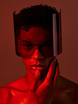 Cyberpunk, glasses and man in red studio, lighting, model and fashion in the future. Dark, tech and face portrait of male with futuristic, edgy and modern style with visor for cyber punk aesthetic