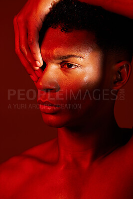 Buy stock photo Red beauty, light and face of model with creative shadow design, artistic neon lighting and luxury skincare. Sweat, hard work and aesthetic creativity of serious black man isolated on red background 