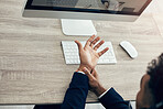 Hand pain, computer and business man working in office while suffering from arthritis, injury and muscle inflammation from above. Wrist pain, worker and man with carpal tunnel syndrome while typing