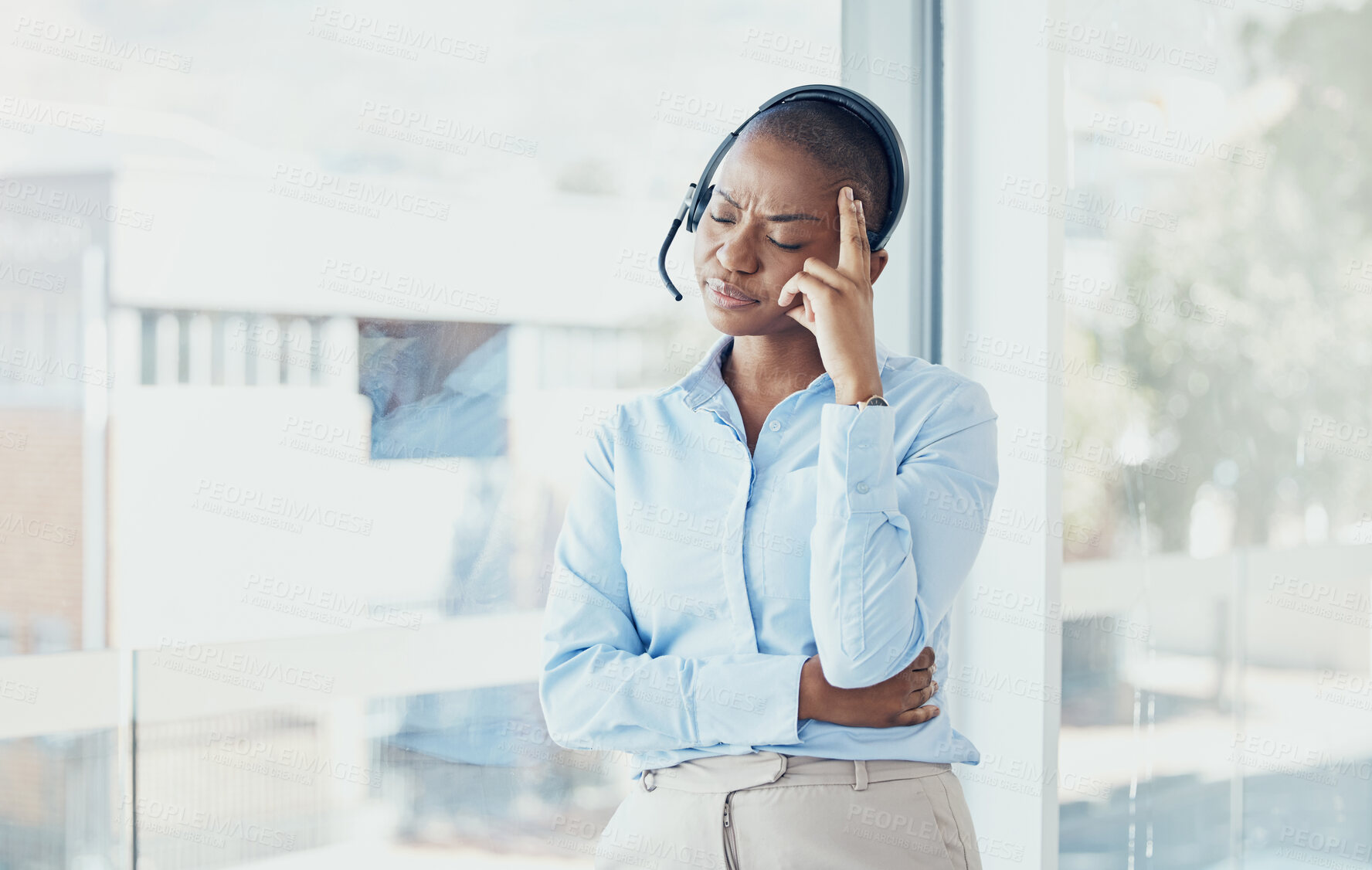 Buy stock photo CRM, stress customer service or black woman with headache, telemarketing burnout or contact us depression in office. Sales advisor, call center or consultant with mental health, frustrated or anxiety
