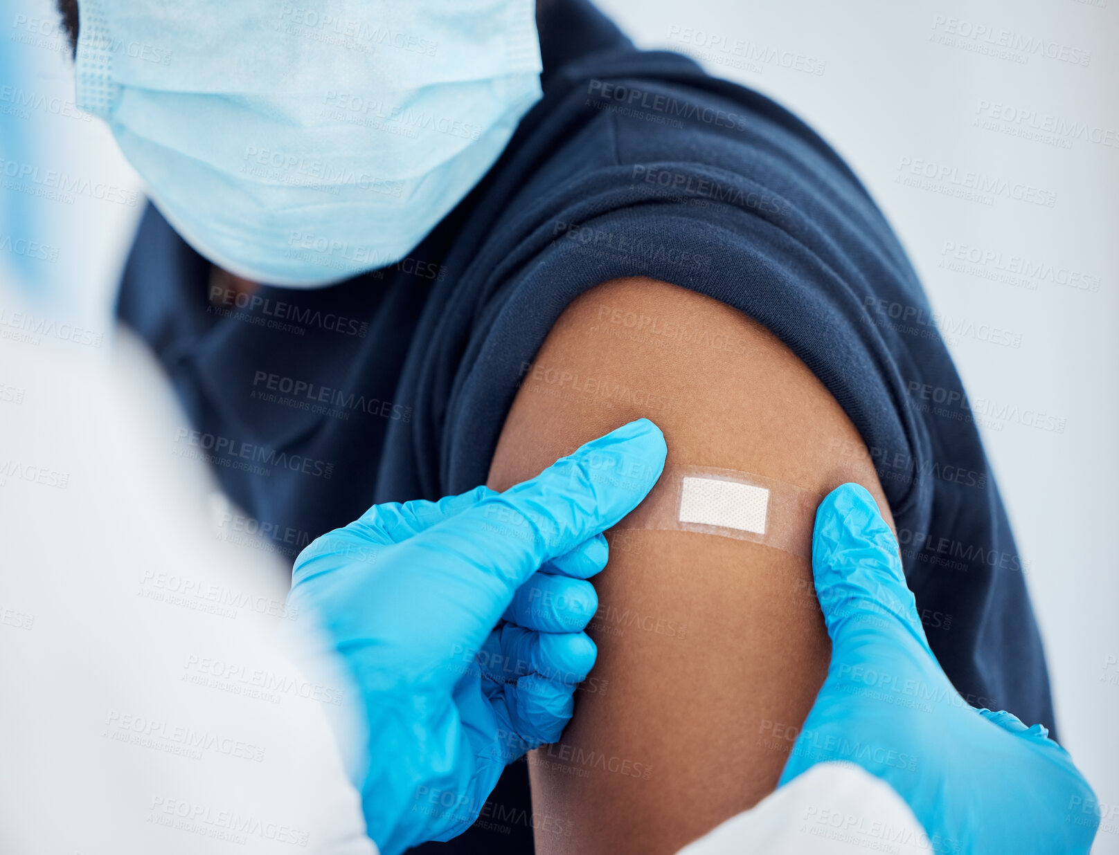 Buy stock photo Covid vaccine, plaster and doctor with patient for healthcare consultation, hospital first aid or covid 19 medical service. Corona virus, band aid and prevention vaccination for black man at clinc