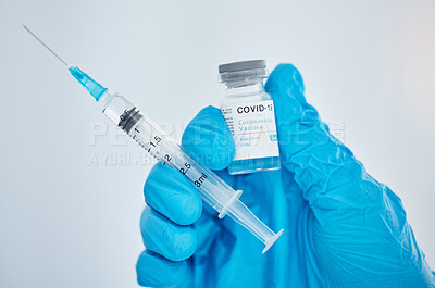 Buy stock photo Doctor, hand and covid vaccine, syringe and medicine for health, safety and protection from virus against mockup space background. Medical expert, glove and covid 19 treatment for pandemic healthcare