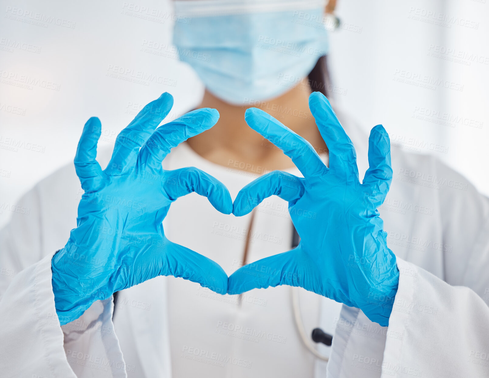Buy stock photo Doctor, hands and heart sign for covid healthcare, love or trust for health and safety at the hospital. Hand of female nurse showing hearty emoji, icon or gesture in medical protection at the clinic