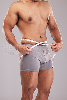 Man, body or measuring tape on waist on studio background for weight loss  management, fat control