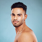 Health skincare and a portrait of man, topless with healthy skin and natural glow after detox facial and smile on face in India. Male body care, fitness and self love in studio with blue background.