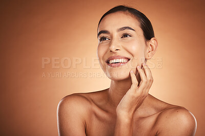 Buy stock photo Thinking, beauty and skincare of hispanic woman against a brown studio background. Clean, smooth face skin of a happy woman after cosmetology and dermatology treatment for health and wellness 