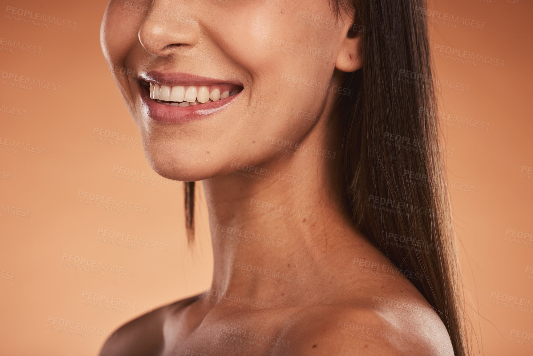 Buy stock photo Beauty, smile and cropped face of woman pose for makeup, cosmetics and beauty products. Wellness, skincare and lips of happy girl with healthy, natural skin and body care in orange background studio