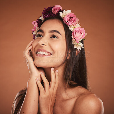 Flower, crown and woman in beauty studio, skincare and wellness while  grooming on orange background. Face, rose and girl model smile, relax and  happy with floral product, facial and plant aesthetic |