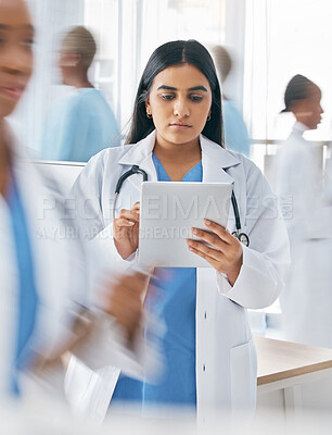 Buy stock photo Doctor, tablet and busy hospital with internet research, online schedule and digital calendar at work. Medical worker working in healthcare clinic planning with digital tech to check patient records 