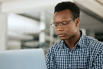 Buy stock photo Thinking, black man and laptop for business, online reading and search internet in office. Young male, entrepreneur and computer for trading, concentration or focus for research, stress and workplace