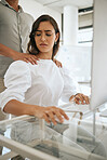Sexual harassment, uncomfortable and awkward with a business woman feeling negative about man hands on her shoulders. Stop, wrong and advantage with a female victim working on a computer in an office