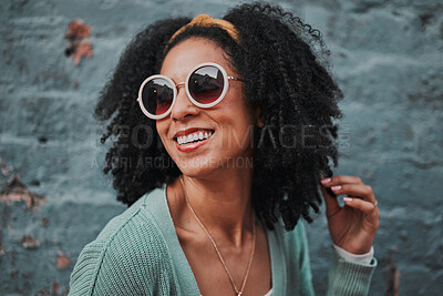 Buy stock photo Black woman, fashion and smile with stylish glasses for summer travel against an urban wall background. Happy African American female smiling in satisfaction for fun funky style in the outdoors