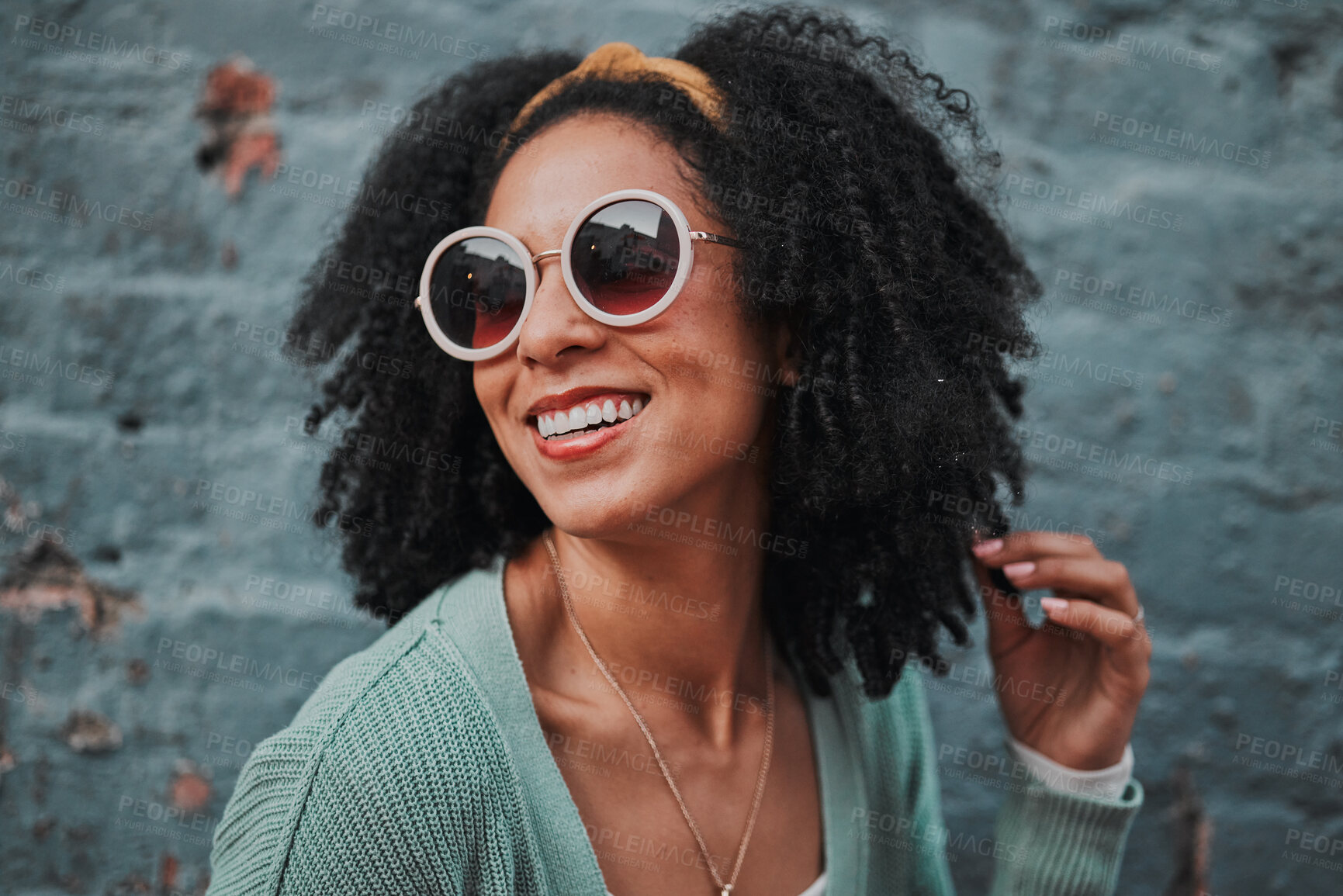 Buy stock photo Black woman, fashion and smile with stylish glasses for summer travel against an urban wall background. Happy African American female smiling in satisfaction for fun funky style in the outdoors